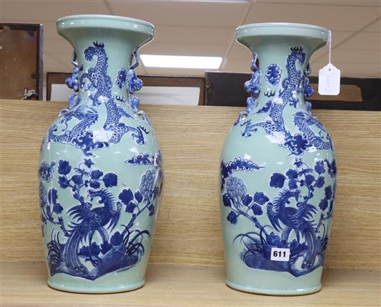 A pair of Chinese vases with dragon design, height 48cm